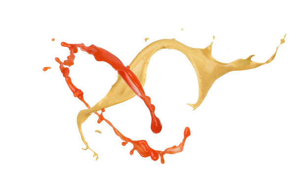 splash of mustard and ketchup on white background splash of mustard and ketchup on white background sauce stock pictures, royalty-free photos & images