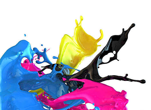 Splashes of blue, black, pink, and yellow paint stock photo