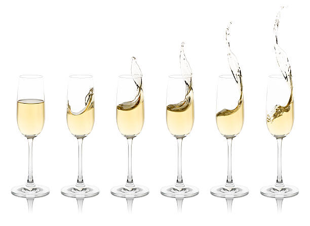 Splashing Champagne Flutes stock photo