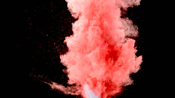 Splashing red powder Close-up of splashing red powder against black background. colored powder photos stock pictures, royalty-free photos & images