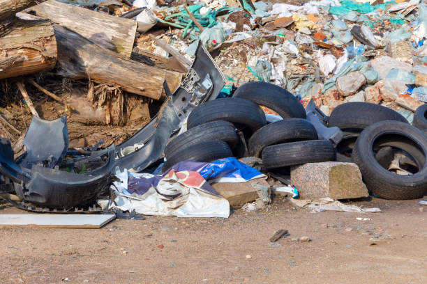 Spontaneous garbage dump in an industrial area stock photo