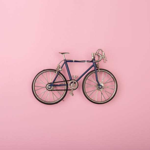 Sport concept - toy bicycles on pink background stock photo