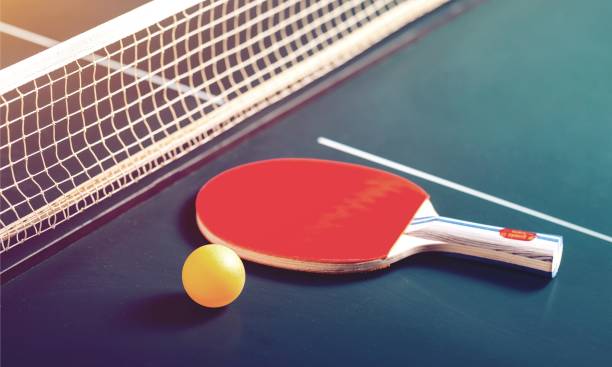 Sport. Table Tennis Rackets and Ball on Table with Net table tennis stock pictures, royalty-free photos & images