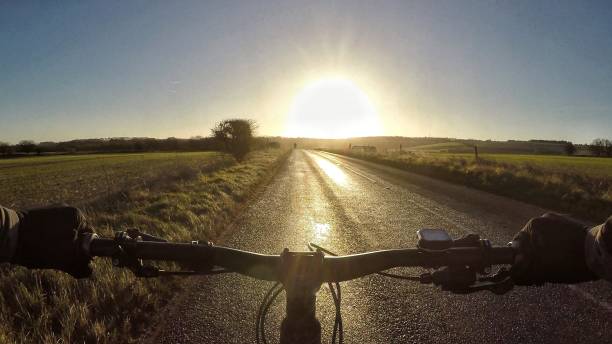 POV Sports riding a mountain bike on a countryside road on a cold winter day in Oxfordshire, England stock photo