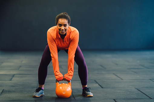 Push-ups on kettlebells, sports training in gym