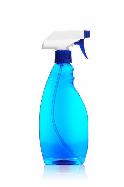 Spray bottle of blue window cleaner on a white background stock photo