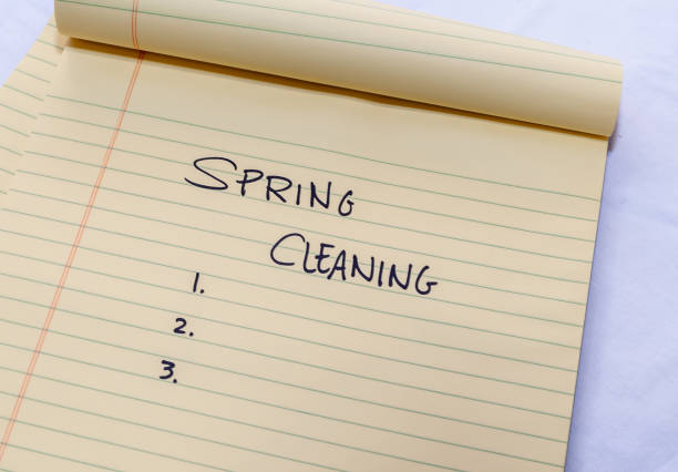 A Spring Cleaning list written on a yellow legal pad stock photo
