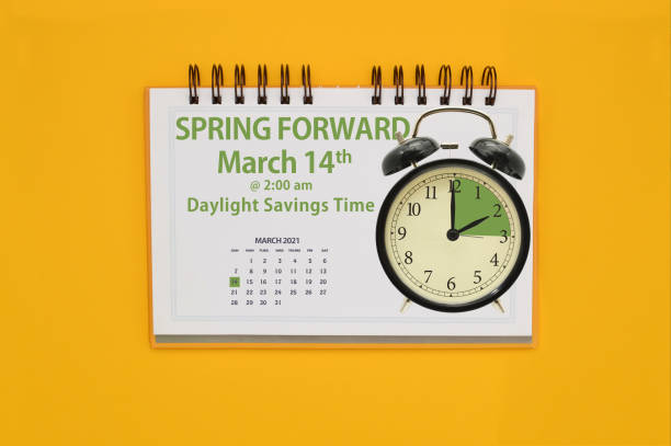 Spring Forward Spring Forward daylight savings time clock and sign on yellow background daylight savings 2021 stock pictures, royalty-free photos & images