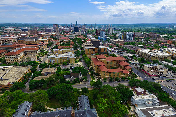 Springtime Austin Over University of Texas UT Tower Colorful Spring Time Austin Over University of Texas UT Tower. 2016. The Ut Tower stands in front of the Austin Skyline Cityscape background. Colorful buildings all around a real gorgeous site above the Capital City of Austin Texas.  texas shooting stock pictures, royalty-free photos & images