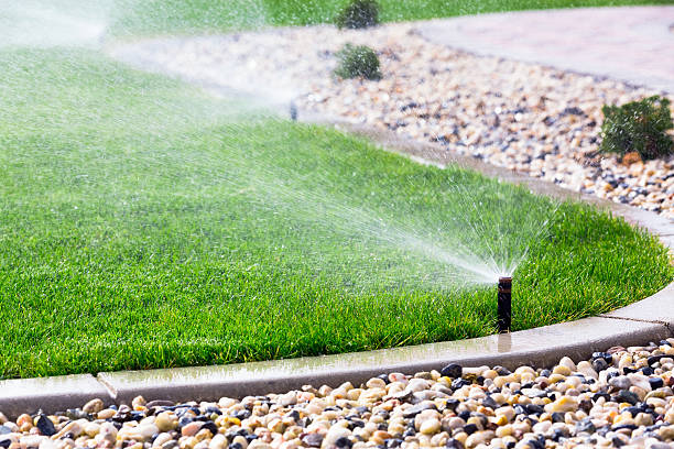 Sprinklers Automatic sprinklers watering lawn irrigation equipment stock pictures, royalty-free photos & images