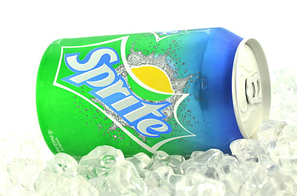 Sprite drink in  can on ice isolated on white background stock photo