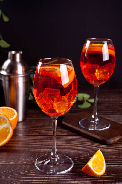 Spritz Italian cocktail alcoholic beverage with ice cubes and oranges. stock photo