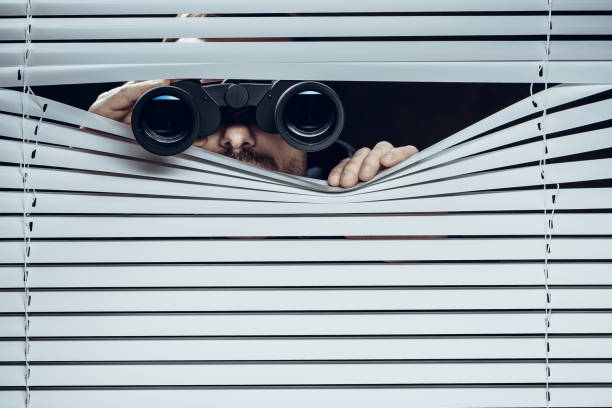 Spy Spy at work. Man with binoculars. surveillance stock pictures, royalty-free photos & images