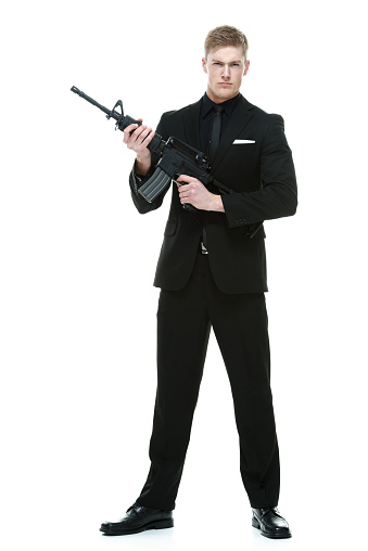 Spy Posing With Gun Stock Photo - Download Image Now - iStock