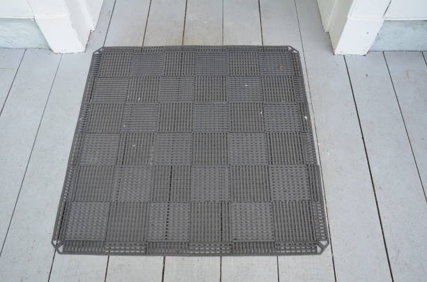 square black rubber mat on wood deck stock photo