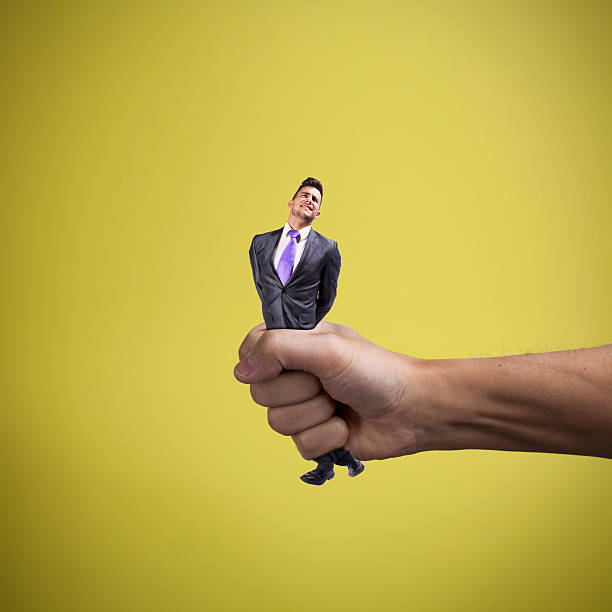 Squeezing the businessman stock photo