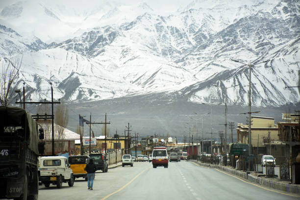 Srinagar Leh Ladakh highway at Leh Ladakh in Jammu and Kashmir, India JAMMU KASHMIR, INDIA - MARCH 20 : Traffic road and Indian people drive car and riding motorcycle and walking on Srinagar Leh Ladakh highway at Leh Ladakh on March 21, 2019 in Jammu and Kashmir, India leh district stock pictures, royalty-free photos & images