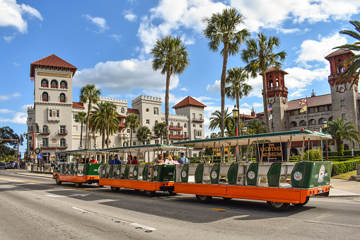 St. Augustine, Florida. January 26 , 2019. Trolley Tour, Casa Monica Hotel and Lightner Museum on lightblue cloudy sky background  at Old Town in Florida's Historic Coast (3)