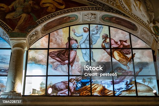 istock St. Caterina del Sasso stained glass window. Color image 1364228737