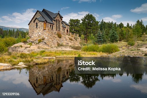 istock St Catherines Chapel on the Rock Church in the Rocky Mountains of Colorado, reflection in lake 1293339136
