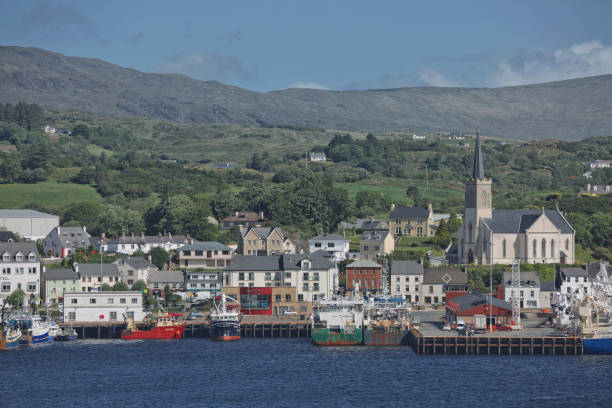 St. Mary's church and port of Killybegs in county Donegal, Ireland's largest fishing port Killybegs, County Donegal, Ireland - June 10, 2017: St. Mary's church and port of Killybegs in county Donegal, Ireland's largest fishing port. county donegal stock pictures, royalty-free photos & images