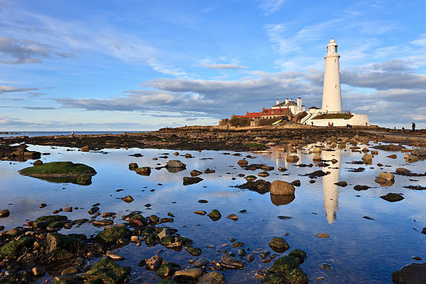 St Mary's lighthouse during the day Reflections of St Mary's Lighthouse near Whitley Bay in Northumberland northumberland stock pictures, royalty-free photos & images