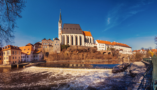 St. Vitus church in Cesky Krumlov, river Vltava in foreground, Czech Republic