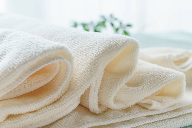 Stack of clean towels on wooden background Stack of clean towels on wooden background towel stock pictures, royalty-free photos & images