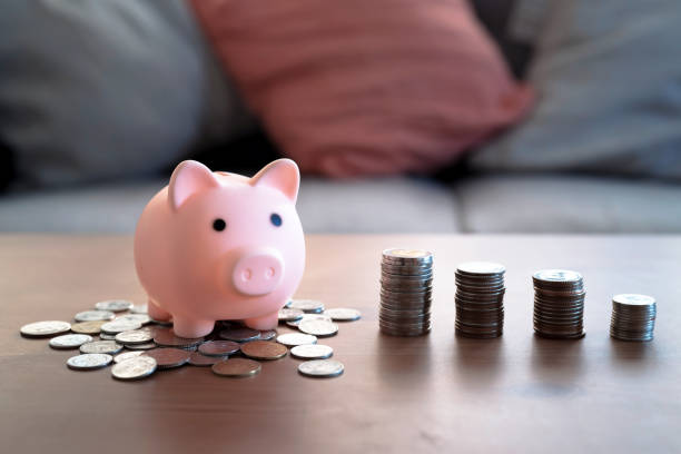 Stack of coins and piggy bank, Saving money concept. stock photo