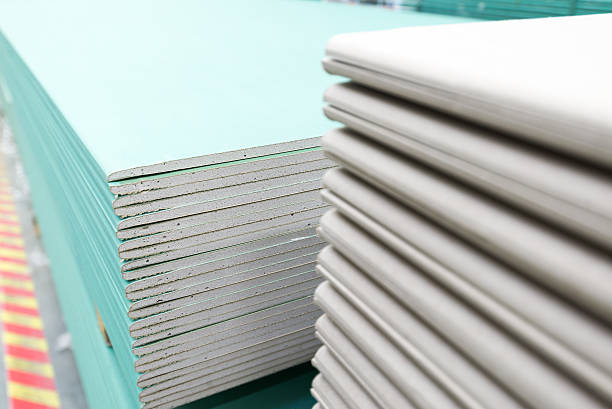 stack of gypsum board preparing for construction stock photo