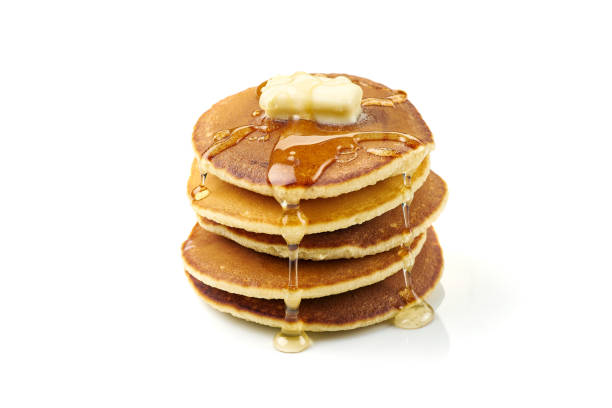 pila di pancake con burro e miele su bianco - pancake foto e immagini stock