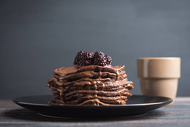 Stack of pancakes with fresh blackberries stock photo