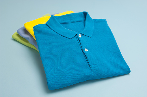 A Stack Of Polo Shirts In Varying Colors Stock Photo - Download Image Now -  iStock