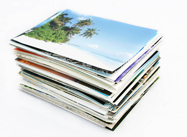 Stack of postcards A stack of postcards. Image on top is on Maldives. Focus on edge of cards in front. stack photos stock pictures, royalty-free photos & images