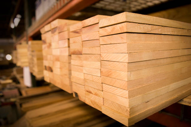 A Stack of Wood on the Shelf in a Woodshop A Stack of Cherry Wood Boards on the Shelf. lumber stock pictures, royalty-free photos & images