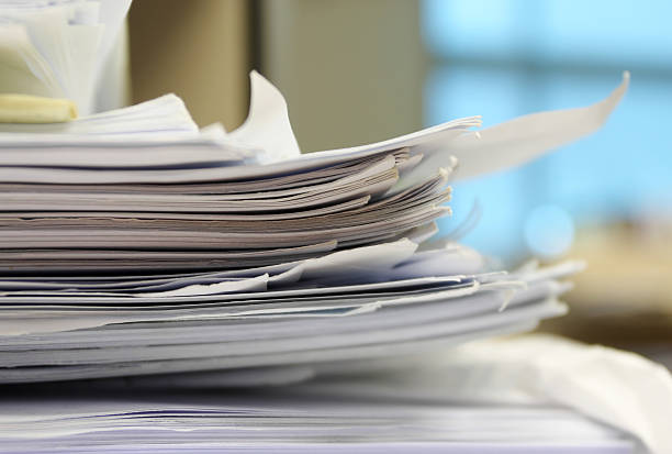 Stack of work papers stock photo