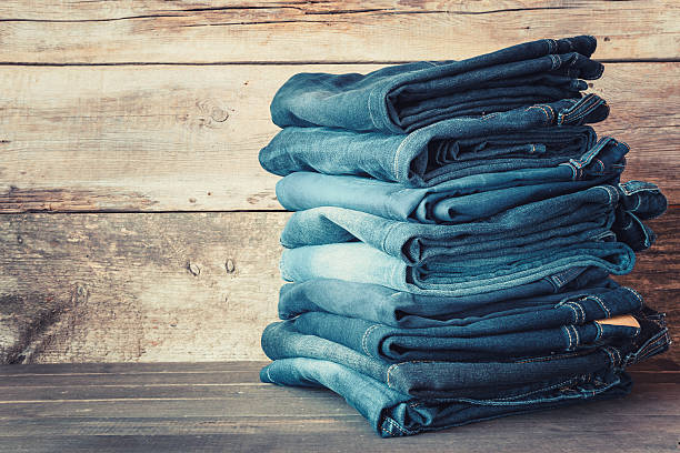 Stacked fashion blue jeans Stacked fashion blue jeans in store jeans stock pictures, royalty-free photos & images