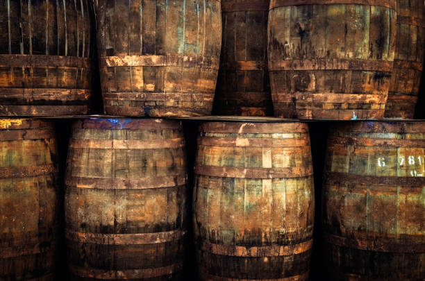 Stacked old whisky barrels stock photo