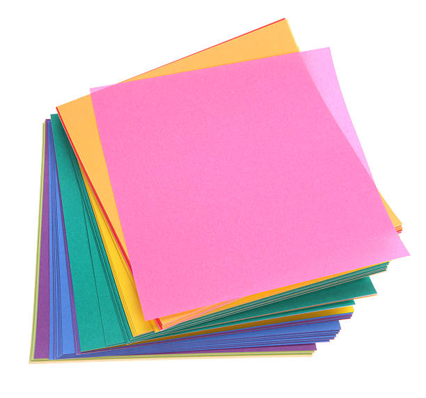 Stacked Paper - Square Colored Paper on White Background stock photo