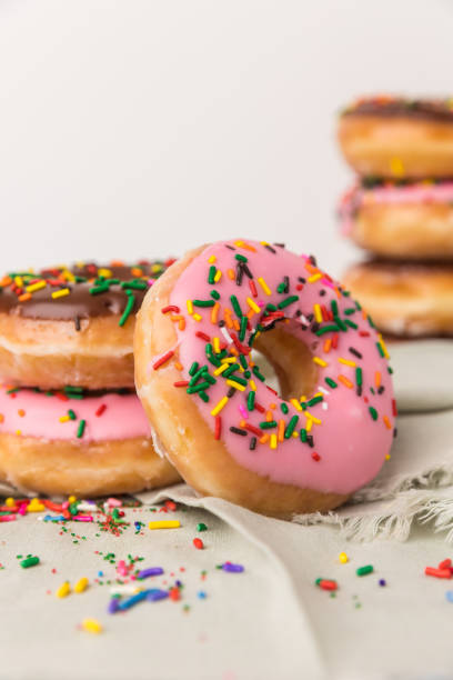 Stacked Sprinkled donuts stock photo