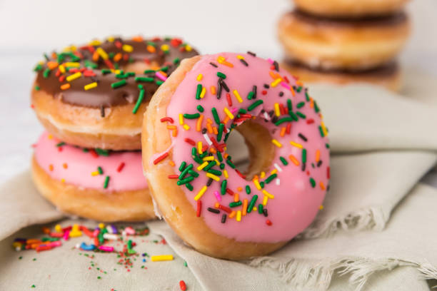 Stacked Sprinkled donuts stock photo
