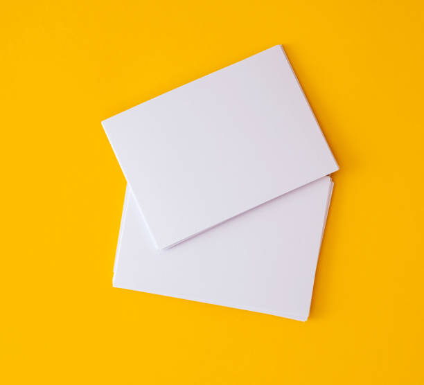 stacking of mockup empty white business card   on vibrant yellow background , template for business  branding  design a stacking of mockup empty white business card   on vibrant yellow background , template for business  branding  design correspondence photos stock pictures, royalty-free photos & images
