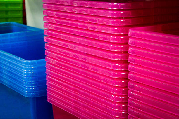 Stacks of colourful plastic boxes stock photo