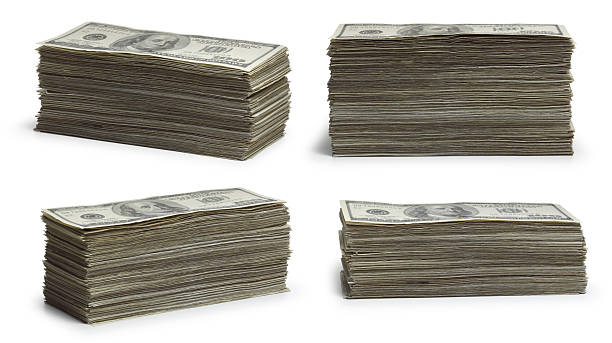 Stacks of Money Four different stacks of $100 bills. pile of money stock pictures, royalty-free photos & images