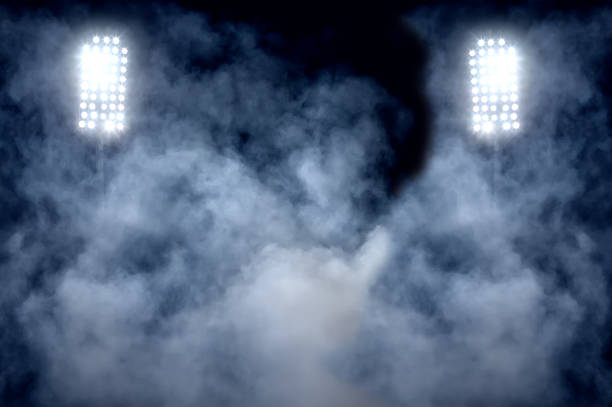stadium lights and smoke stock photo