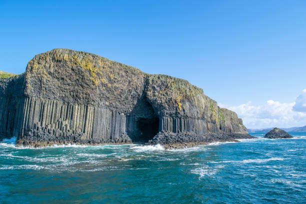 Staffa Island with Fingal's Cave Photo of the remote located isle of Staffa and its iconic cave basalt column stock pictures, royalty-free photos & images