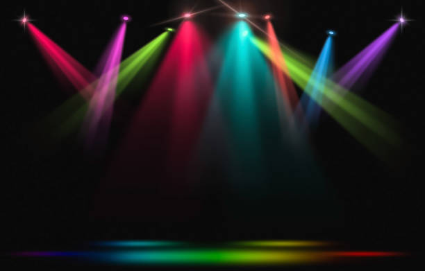 Stage lights. Rainbow spotlight strike through the darkness. stock photo
