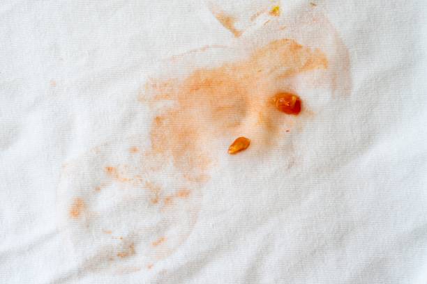 Stain of tomato on white cloth Stain on white cloth or textile ketchup smear stock pictures, royalty-free photos & images