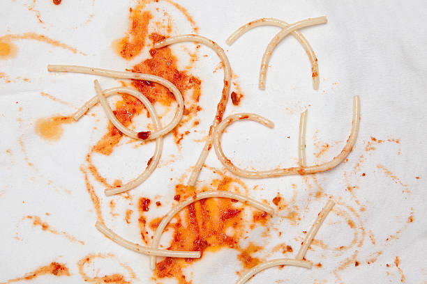 Stained pasta and ketchup stains on the fabric. ketchup smear stock pictures, royalty-free photos & images