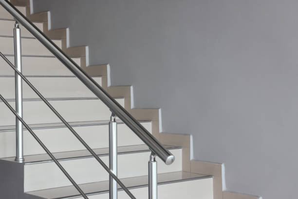 Stairs in the building with metal handrail View of Aluminium Stair Railing and Joint Element bannister stock pictures, royalty-free photos & images